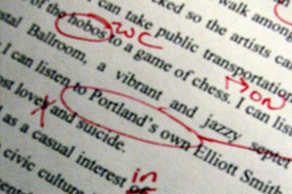 Copyediting text with a red pen