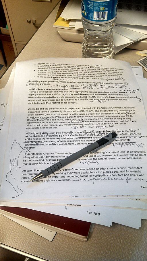 Pen and paper being copyedited
